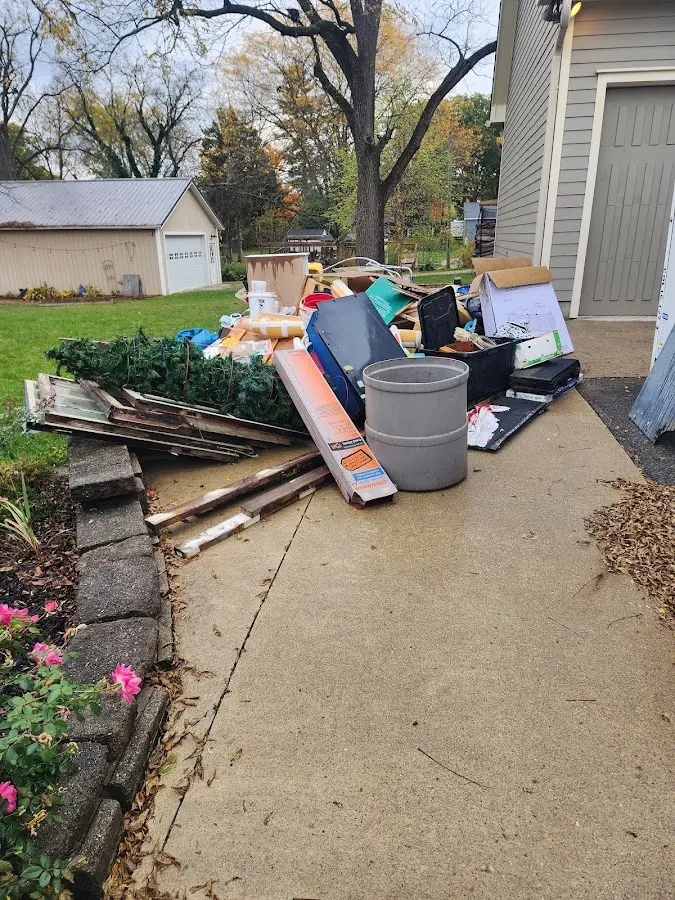 Dumpster being loaded with debris for Roofing Dumpster Rental in South Bloomfield